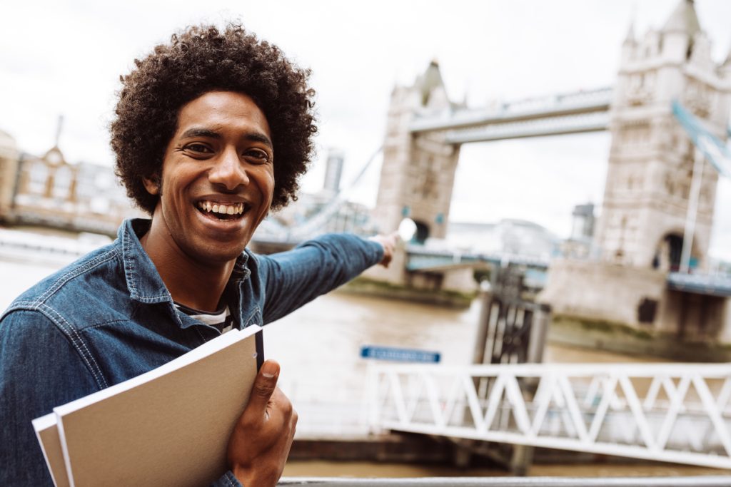 student in london in front of Tower Bridge